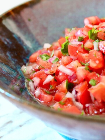 Best pico de Gallo in a blue bowl on a marble countertop