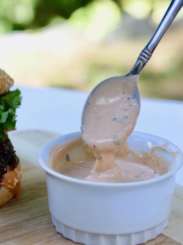 best vegan burger sauce recipe in white bowl on wooden cutting board