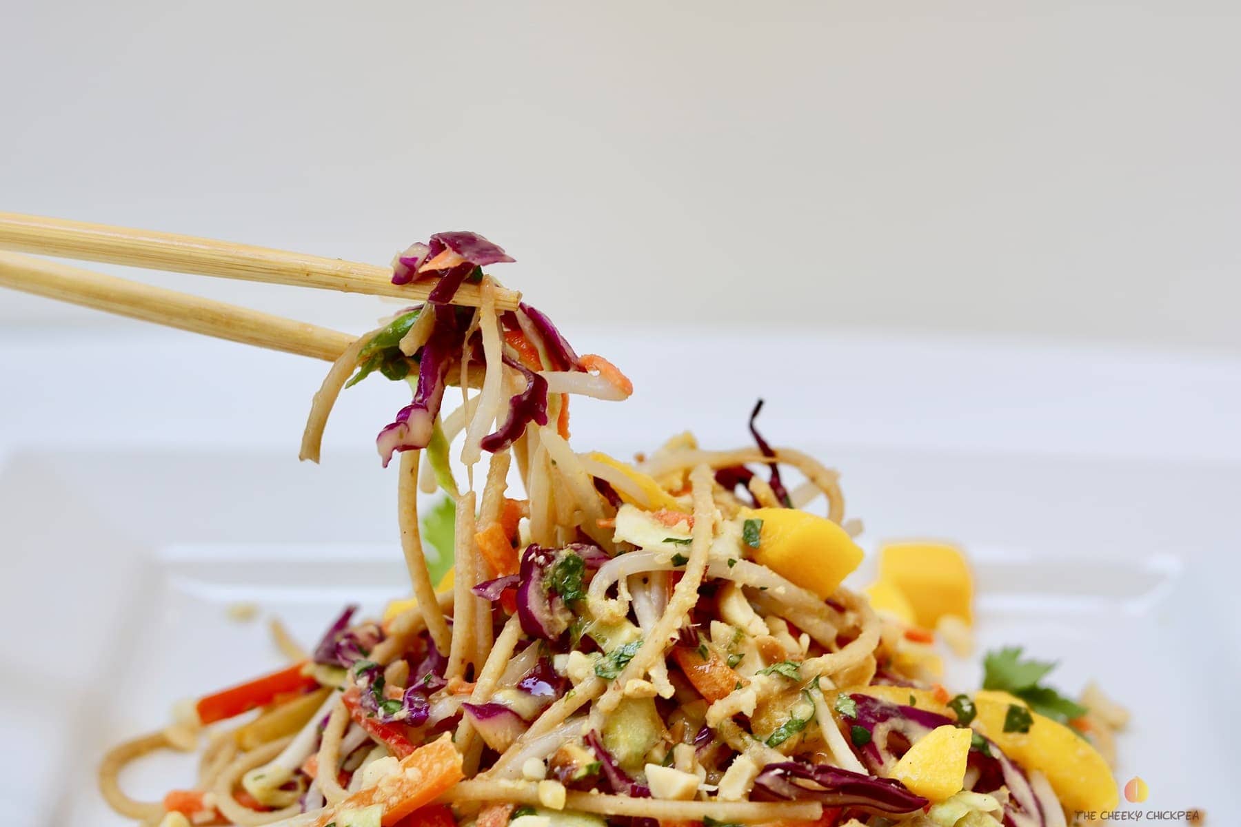 ultimate Thai noodle salad with lemon ginger dressing on a white plate