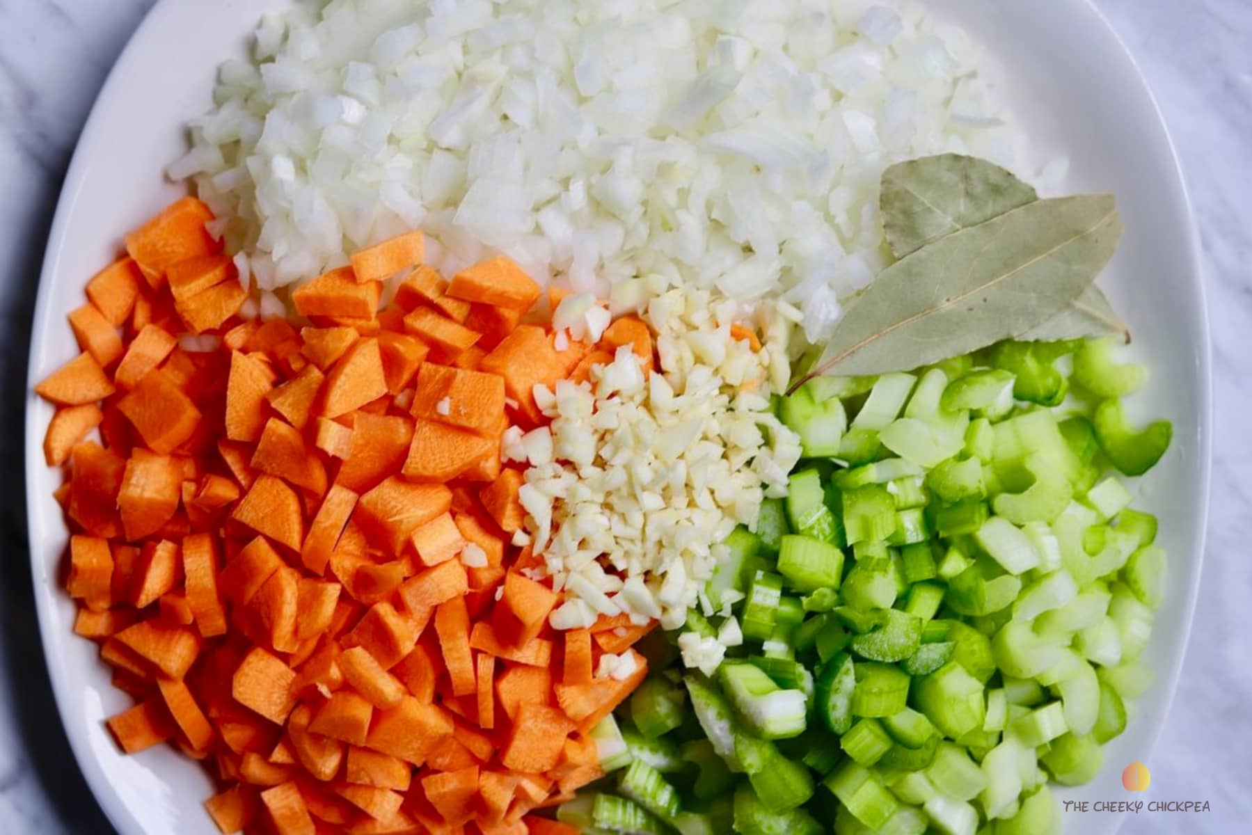 vegetarian split pea soup vegetables on a white plate