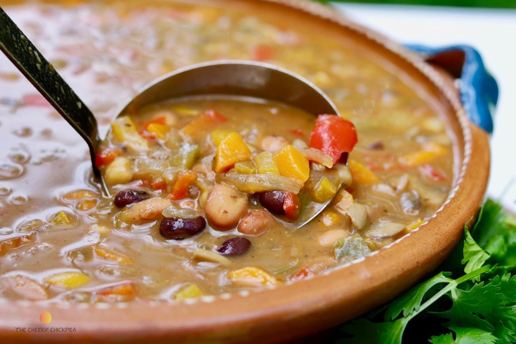 Mexican bean soup in a brown bowl 
