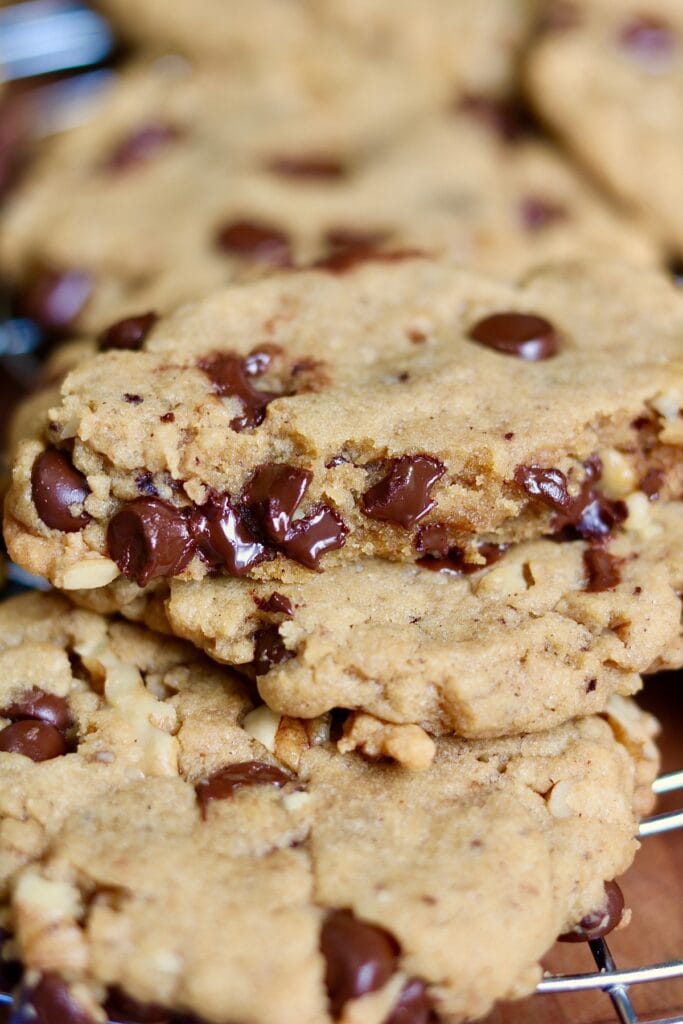 close up of a chocolate chip cookie on a cooling rack