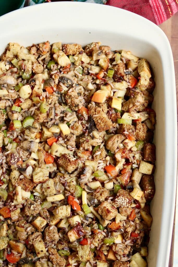 vegan wild rice stuffing baked in a casserole dish ready to serve