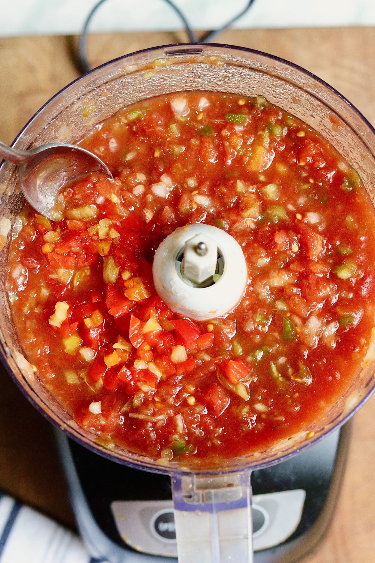 ingredients for restaurant style salsa in a food processor 