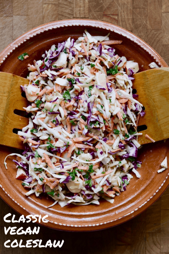 vegan coleslaw in a salad bowl tossed with creamy dressing
