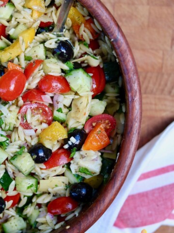 mediterranean orzo salad in a wooden bowl