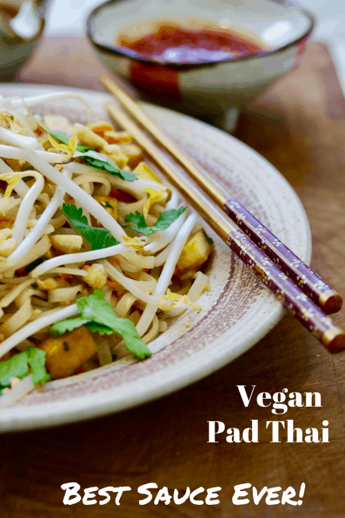 vegan pad thai on a plate with chopsticks