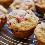 strawberry rhubarb muffins on a cooling rack