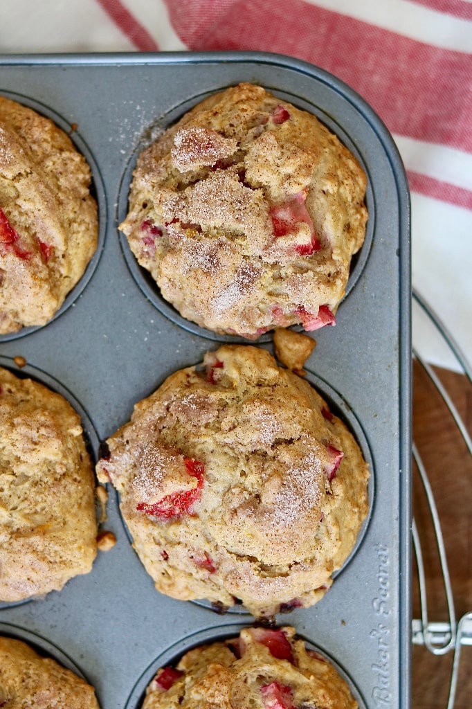 strawberry rhubarb muffins in a muffin tin