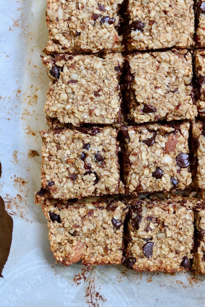 healthy oatmeal breakfast bars sliced on parchment paper