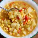 vegan corn chowder in a white bowl
