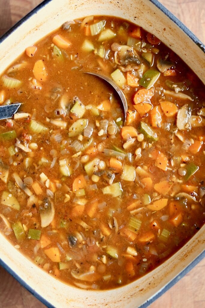  a big pot of italian lentil soup ready to serve