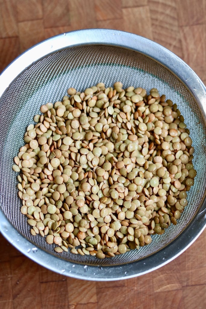 green lentils rinsed in a strainer
