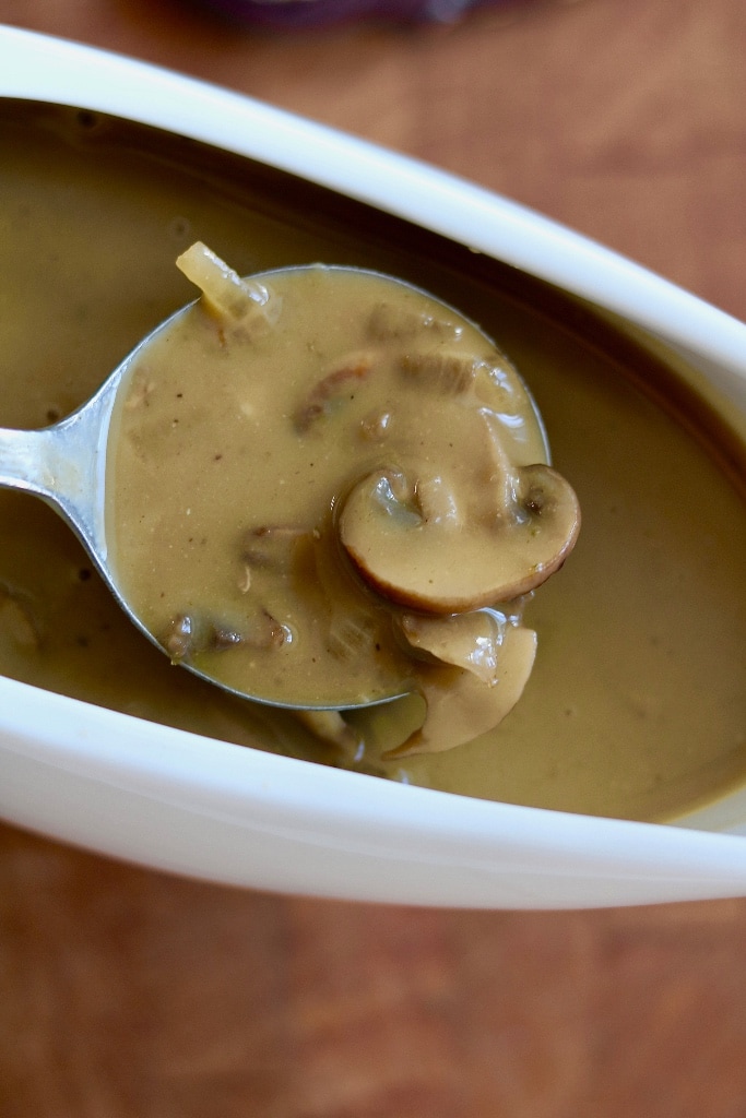 vegan mushroom gravy in a white gravy boat