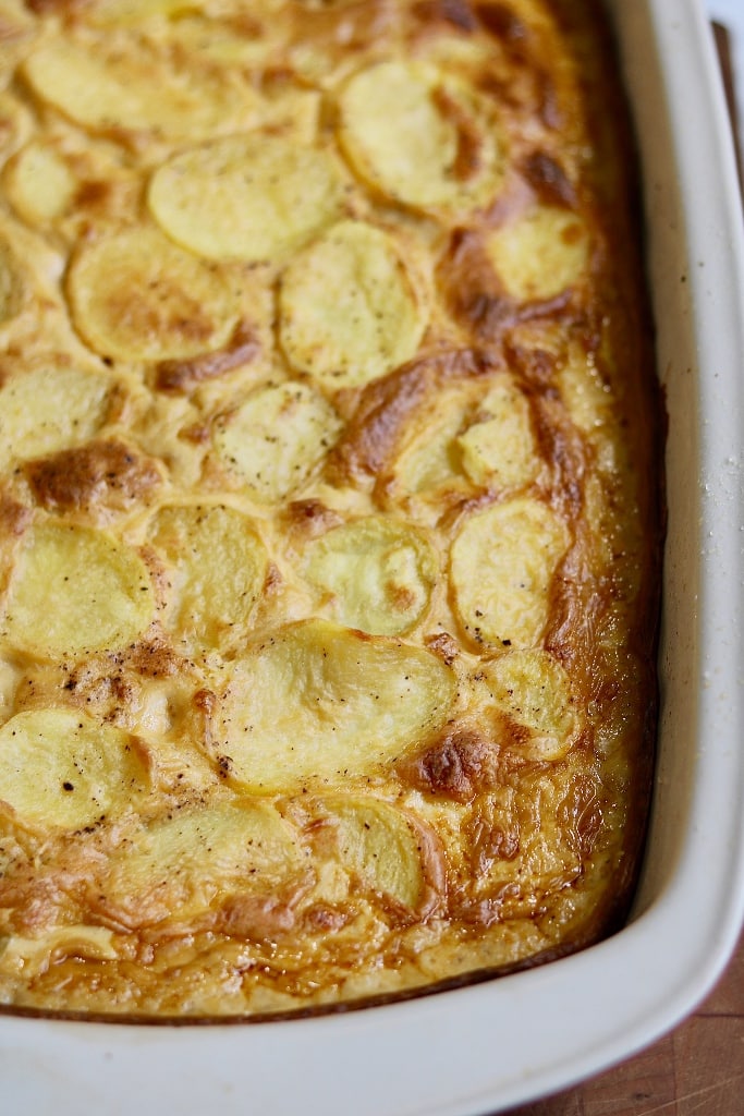 vegan scalloped potatoes baked in a casserole dish 