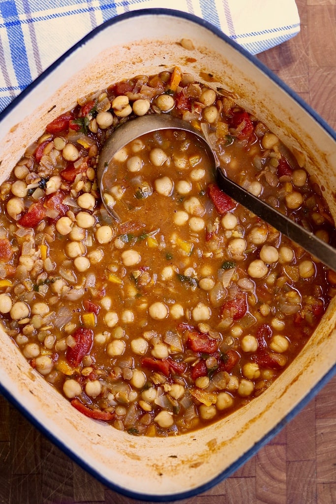 moroccan stew in a pot with a ladle 