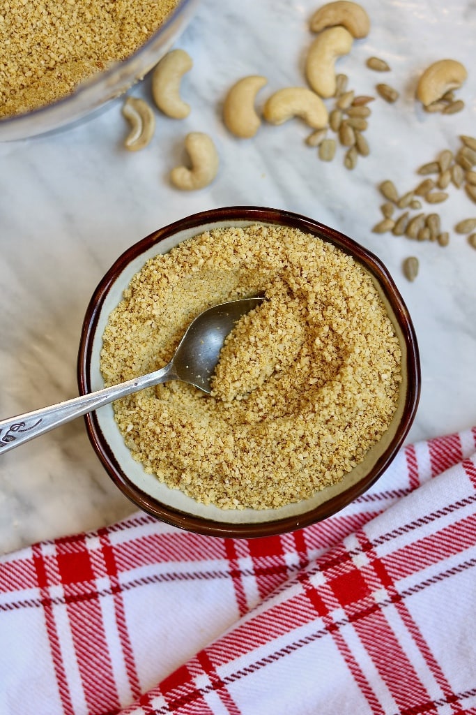 top view vegan parmesan in a bowl with a spoon