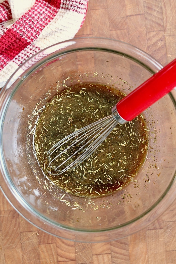 steak marinade in a bowl with a whisk