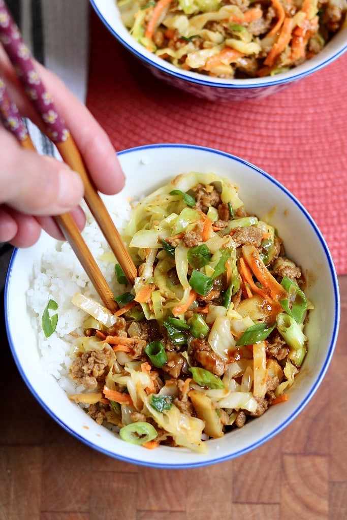 deconstructed vegan egg roll in a white bowl with chopsticks