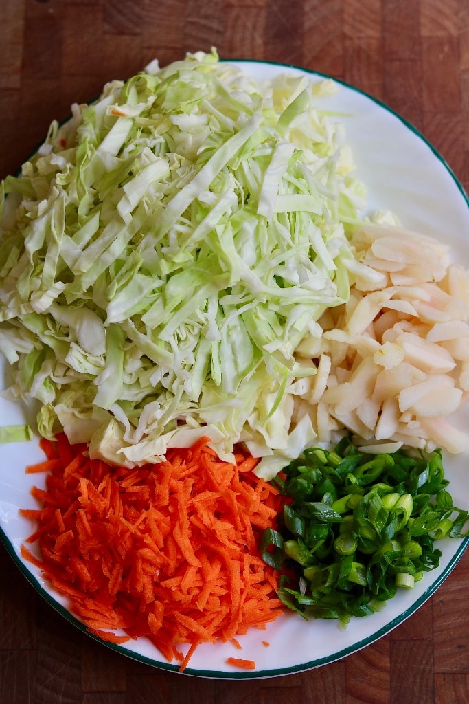 chopped veggies for egg roll recipe on a white plate