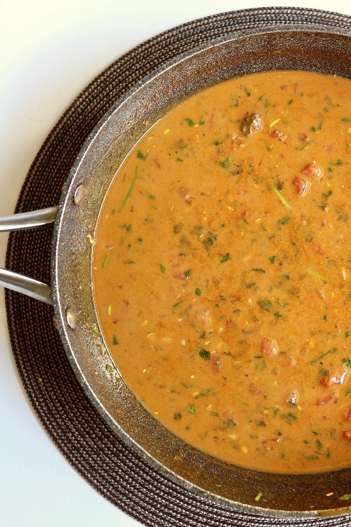 red curry sauce cooked in a skillet