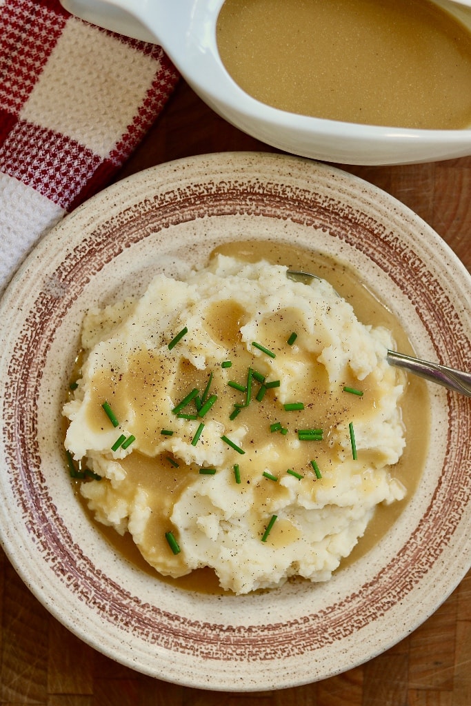 a plate of vegan mashed potatoes and gravy 