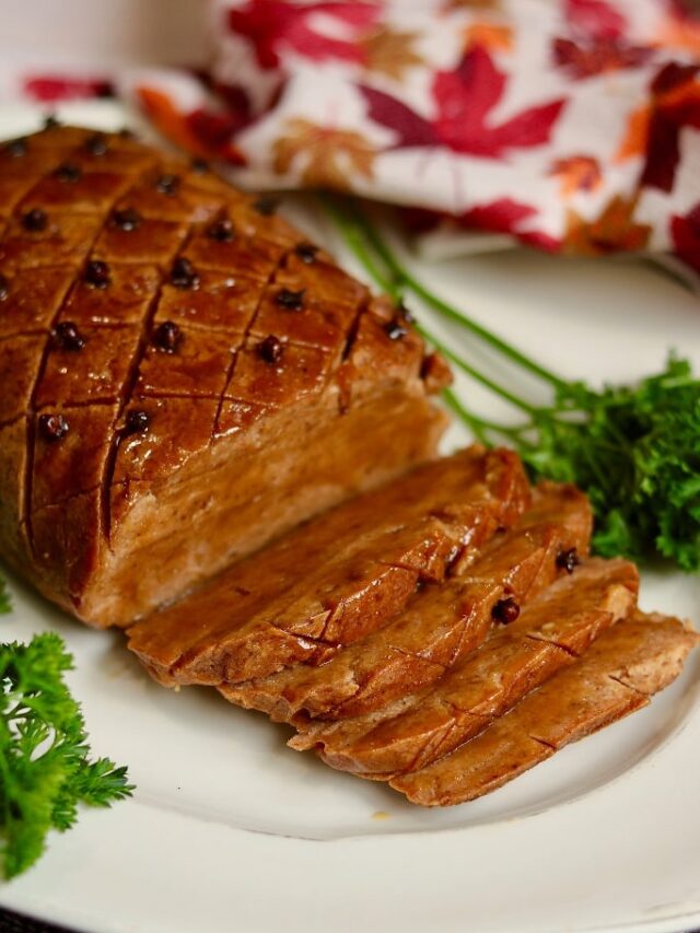 seitan ham sliced on a serving plate