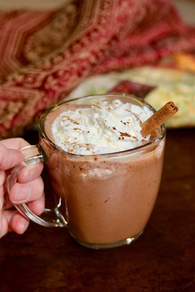 a cup of vegan hot chocolate with coconut whipped cream 