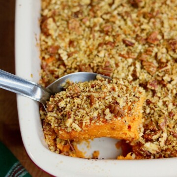 vegan sweet potato casserole being dished out with serving spoon