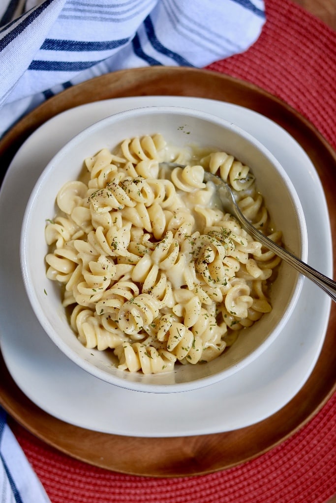 overhead view of bowl of creamy garlic pasta