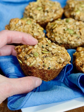 morning glory muffin being taken off of a plate