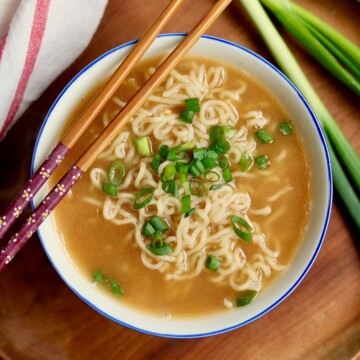 ramen soup in a bowl with chopsticks