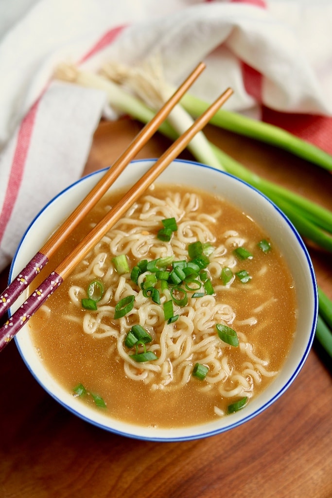 ramen soup with chopsticks on top of bowl