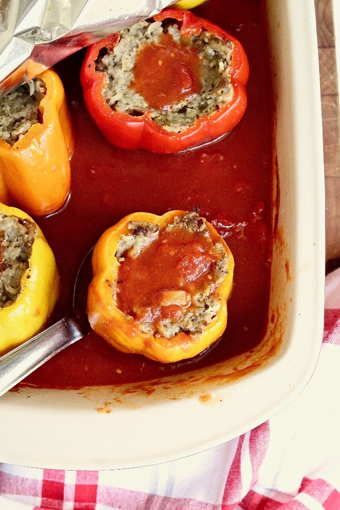 stuffed pepper being served from casserole dish 