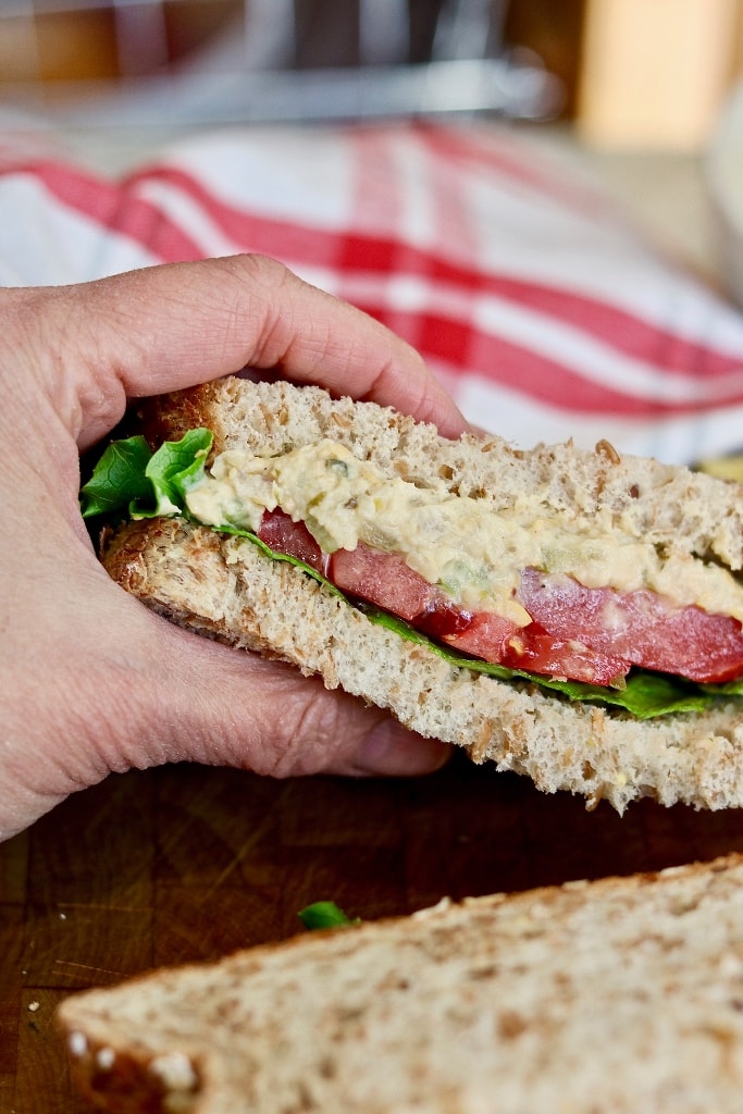 vegan tuna sandwich being picked up