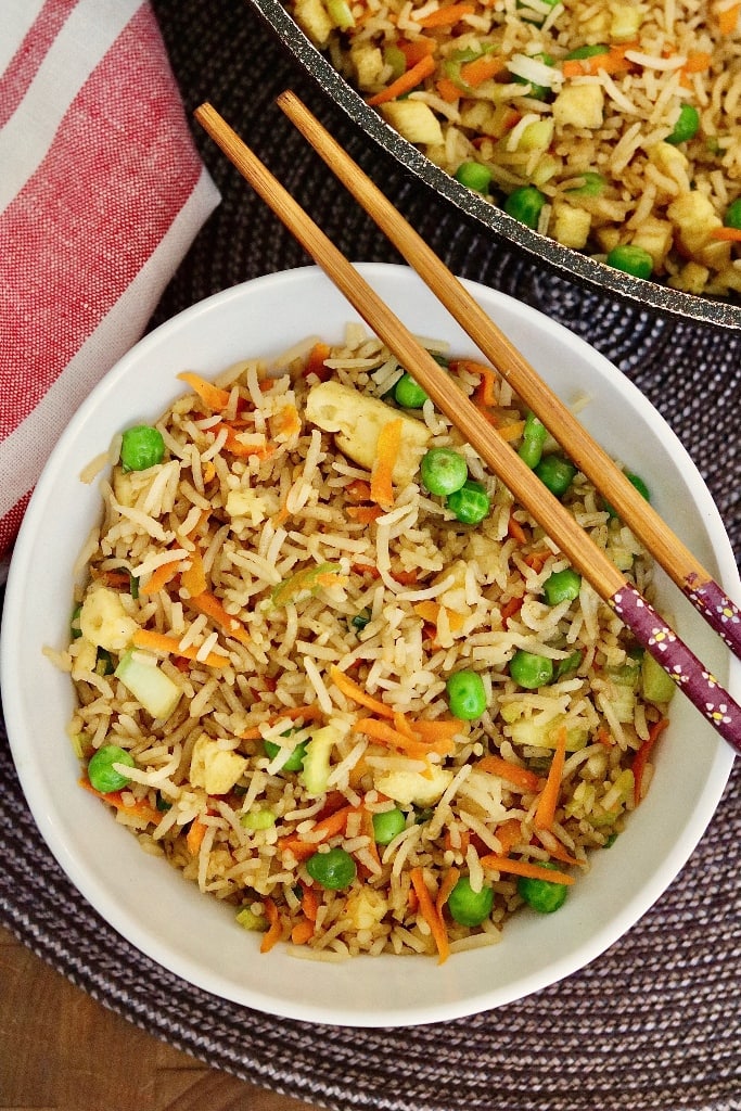 vegan fried rice in a bowl with chopsticks