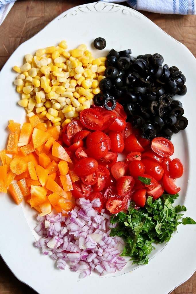pasta salad ingredients chopped on a plate