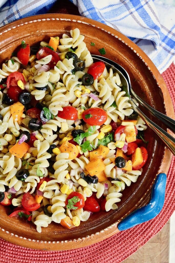 vegan pasta salad ready to serve in a salad bowl