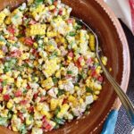 mexican street corn salad mixed in a bowl