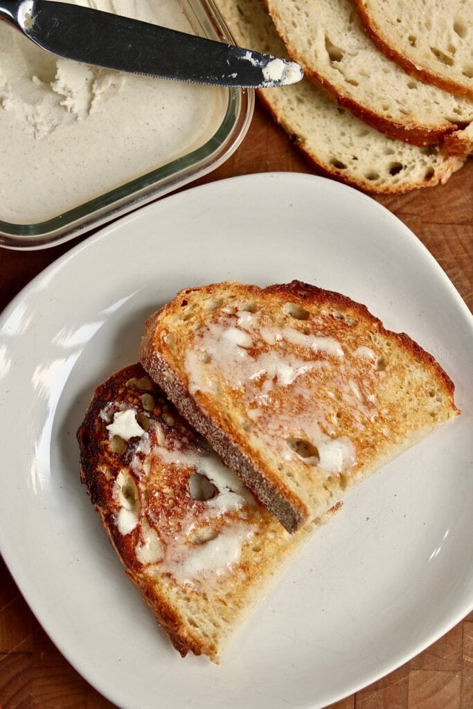 two pieces of toast with vegan butter