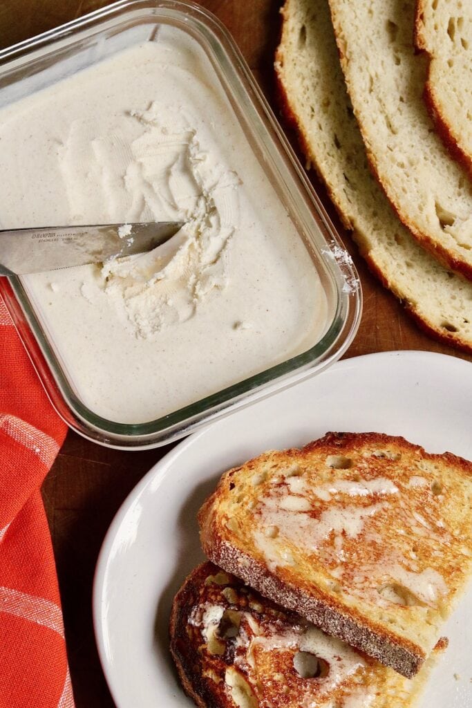 dish of vegan butter along side butter toast 