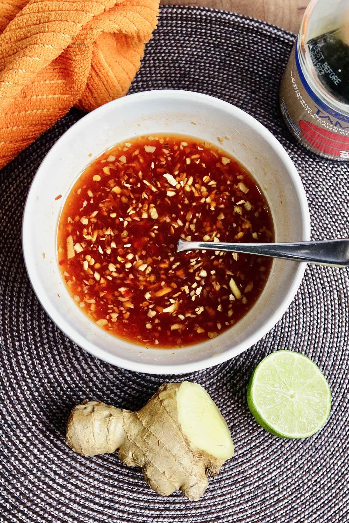 vietnamese dipping sauce ingredients mixed together in a small bowl