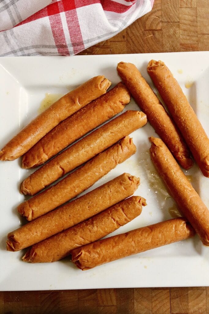 cooked vegan frankfurters on a plate 