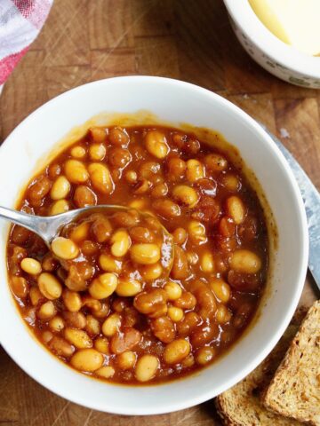vegan baked beans in a bowl with a spoon