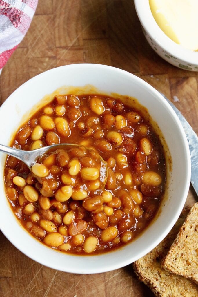vegan baked beans in a bowl with a spoon