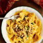 a bowl of pasta noodles tossed with vegan pumpkin pasta sauce