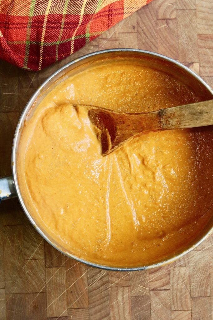 pumpkin pasta sauce ingredients blended and cooked in a pan