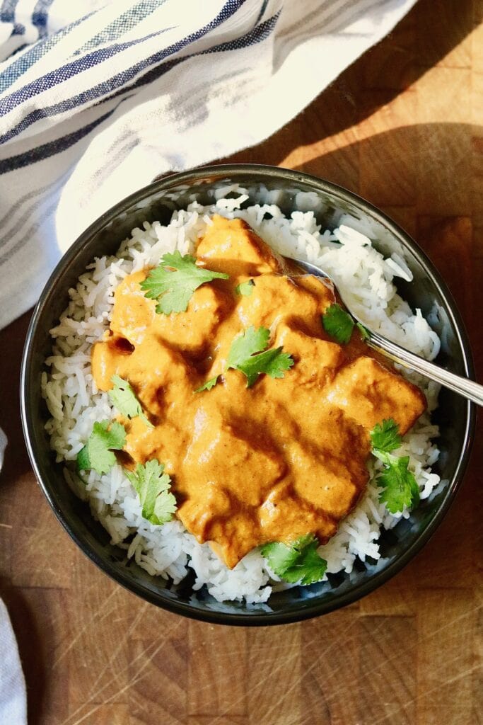 vegan tofu tikka masala in a bowl with rice 