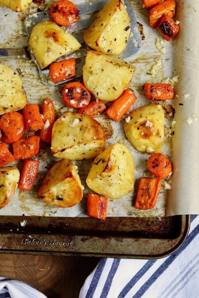 potatoes and carrots roasted on a sheet pan
