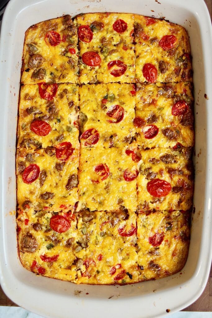 vegan breakfast casserole in a baking dish sliced and ready to serve